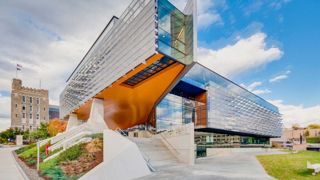 External image of multi-level glass building with stairs and ramp entrances. Warrior Recreation Center, University of Hawaii at Manoa, Honolulu, Hawaii.